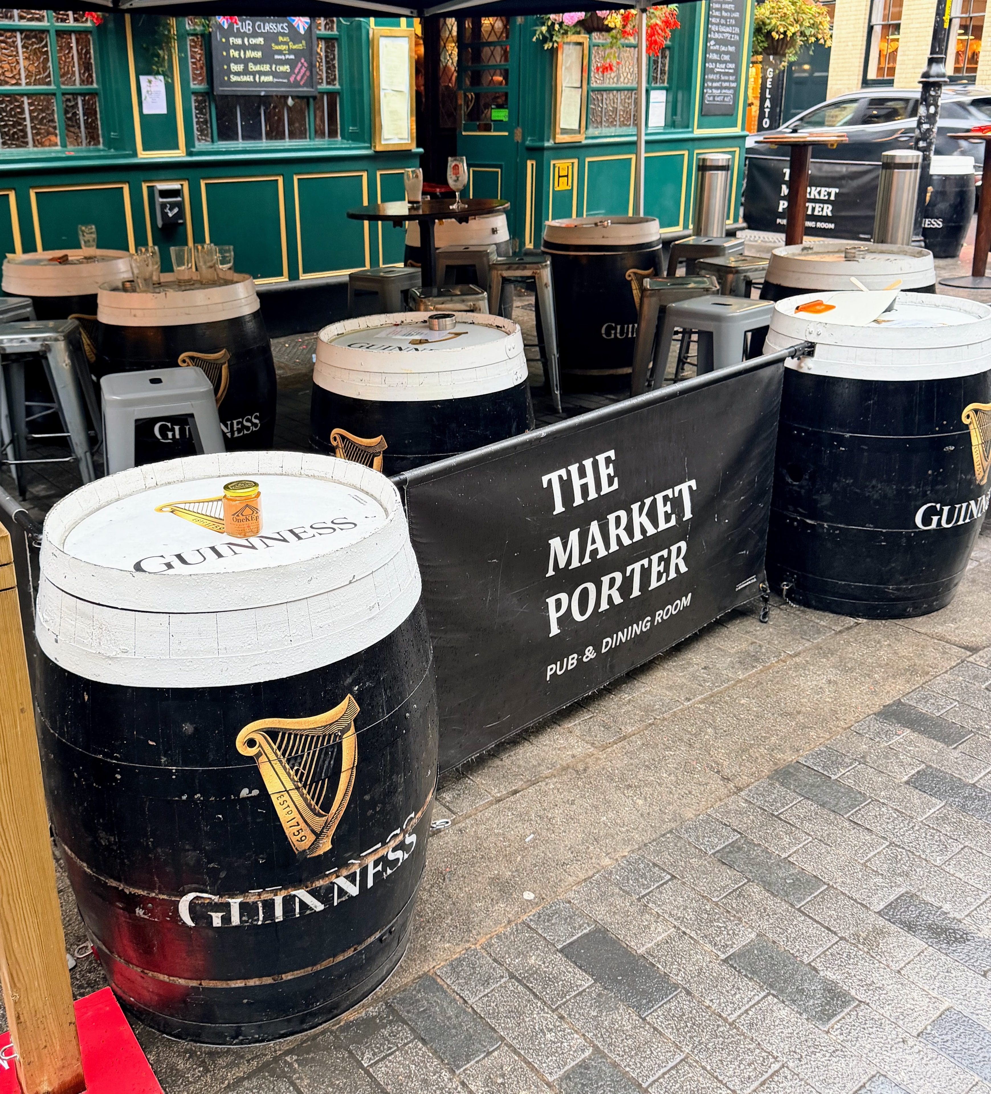 OneKEpp honey jar on a Guinness barrel outside The Market Porter pub in London