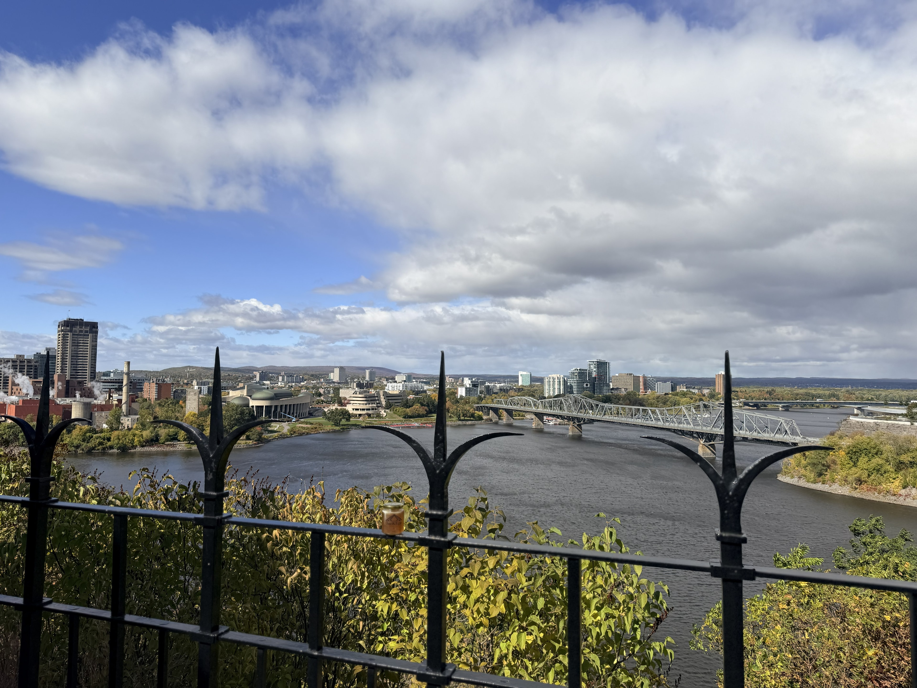 OneKEpp honey jar on the railing overlooking the Ottawa River and Gatineau skyline