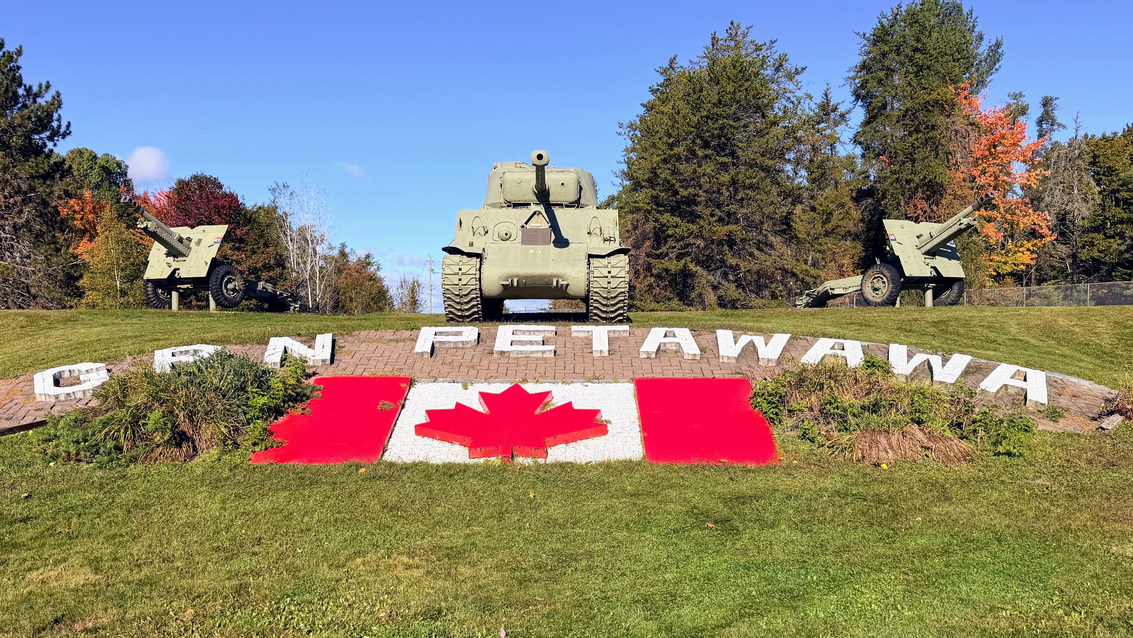 OneKEpp honey jar at CFB Petawawa entrance sign with Sherman tank and Canadian flag